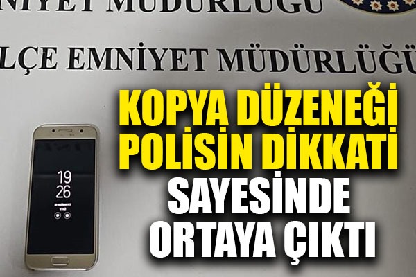 Ehliyet sınavına girerken göğüs kafesinin çukuruna gizlediği cep telefonuyla yakalandı