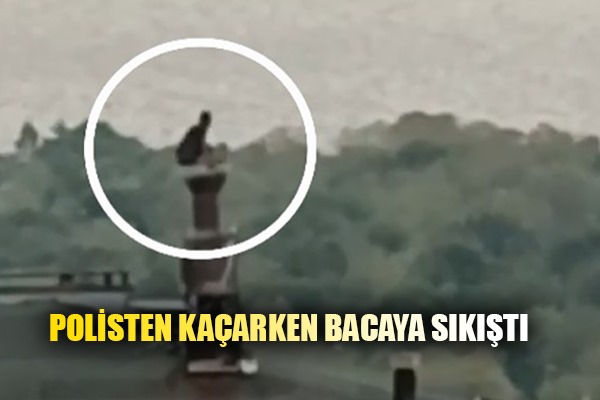 Cezaevi firarisi polisten kaçarken çıktığı çatıdaki bacanın üzerinde yakalandı