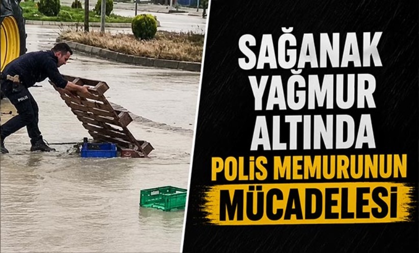 Sağanak yağmur altında görev başında: Polis memurunun mücadelesi kamerada