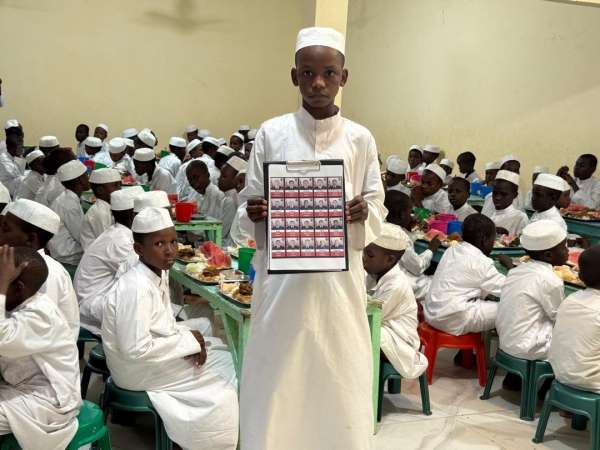 UKABDER'den şehitler için anlamlı anma programı: Çad'da yetimlere yemek ikram edildi, dualar edildi