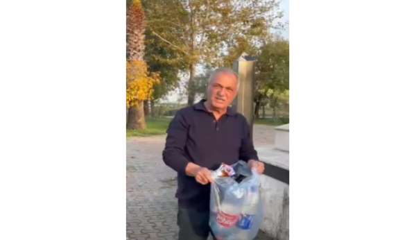 Şehitliğe saygısızlık yapanlara tepki gösterdi, çöpleri tek tek topladı