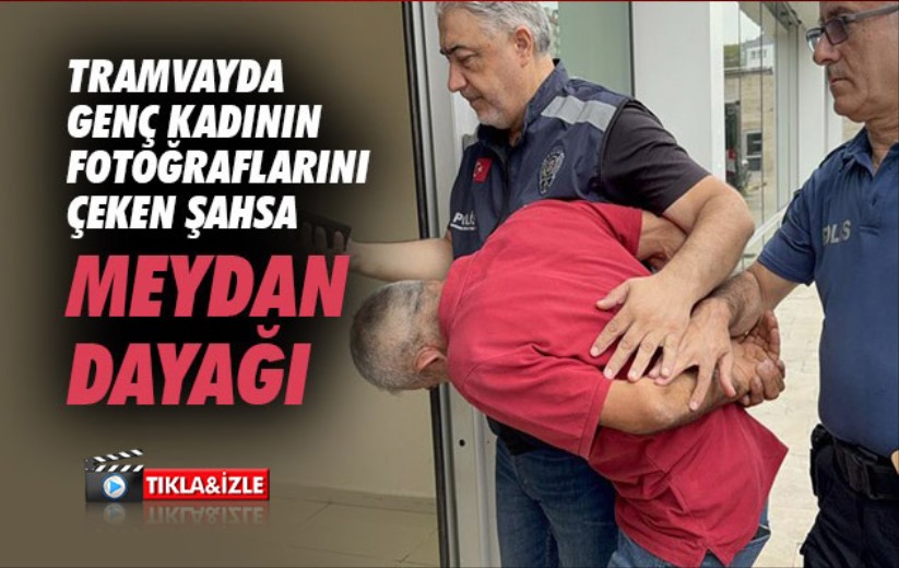 Tramvayda genç kadının fotoğraflarını çeken şahsa meydan dayağı
