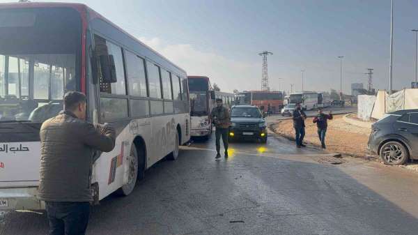 Suriye'de Şeyh Maksud Mahallesine gelen 20 otobüs, teslim olan SDG'li teröristleri farklı bölgelere götürecek